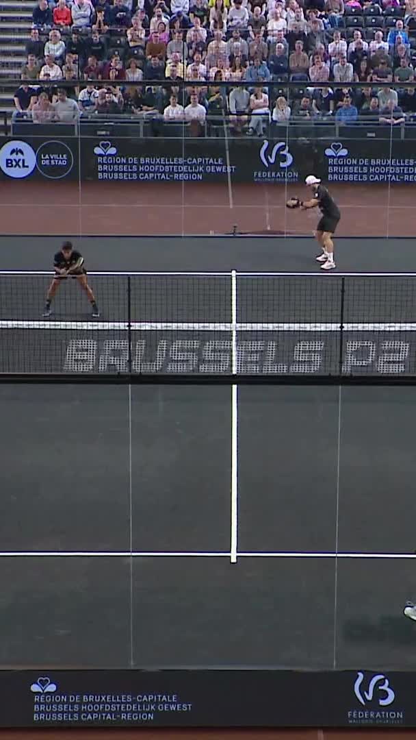 Galan holds serve with an overhead smash