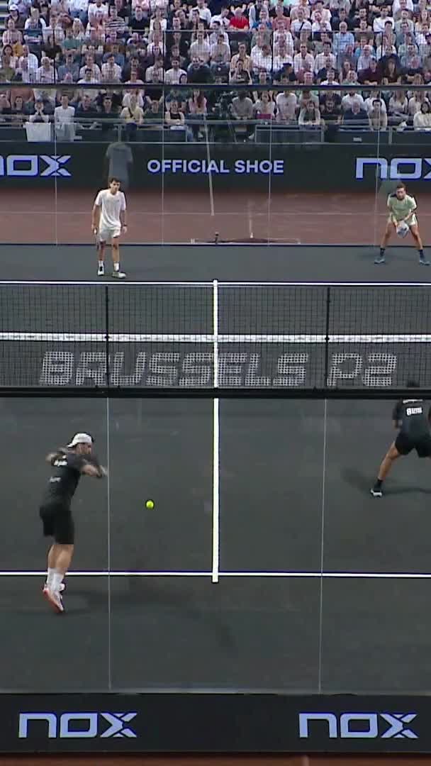 Galan hits a smash to take their fifth straight game of the second set