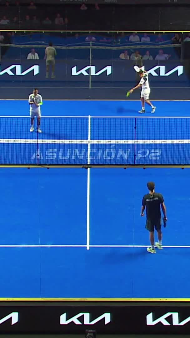 Arce holds serve with an overhead smash