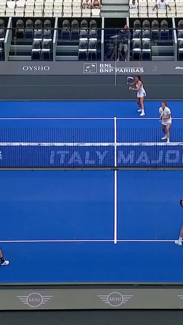 Saiz hits a good forehand winner after an out of the court shot by Marchettit