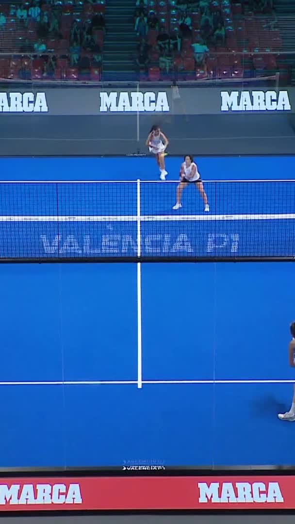 Martinez hits a volley to take a point