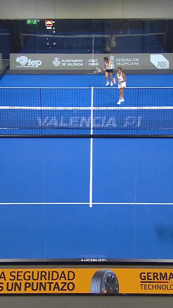 Match point. Sharifova aims against the net