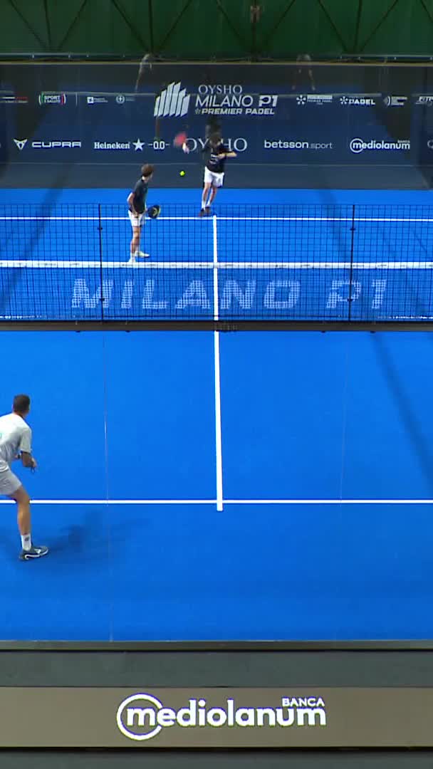 Arroyo recovers the ball from outside the cage, but Gonzalez puts it away to win the point
